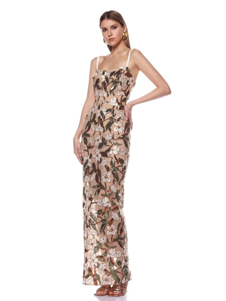 Elegant spaghetti strap sequin dress with floral appliques.