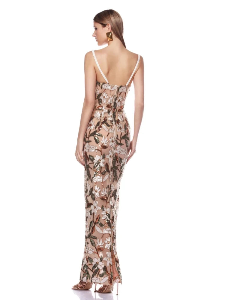 Elegant spaghetti strap sequin dress with floral appliques.